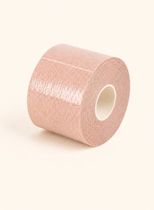 A nude roll of double-sided body tape