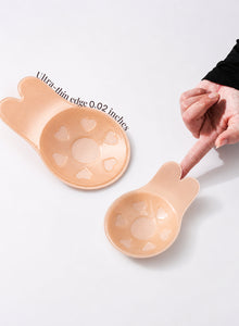 A finger pressing the ultra-thin lift to show how much it flexes
