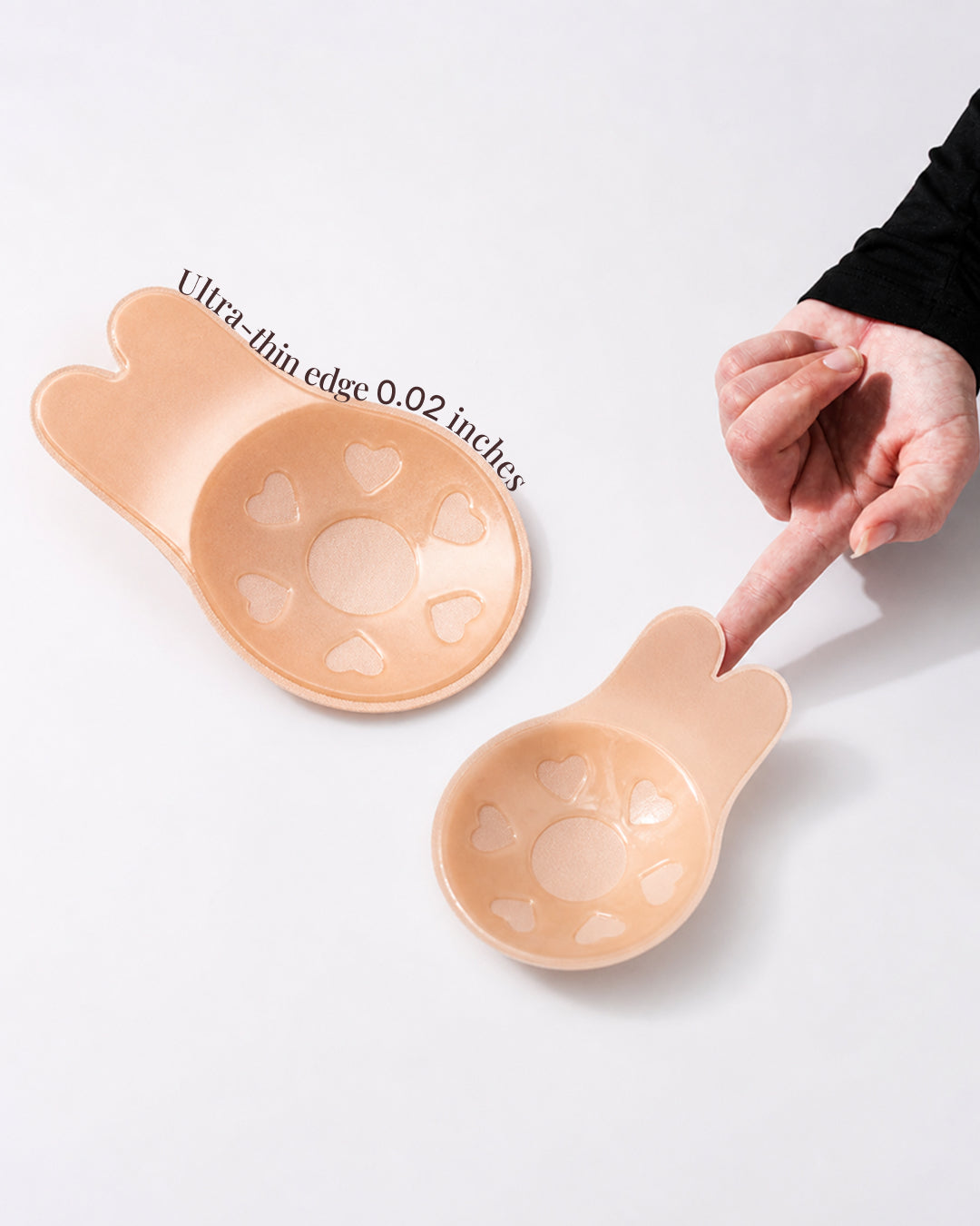 A finger pressing the ultra-thin lift to show how much it flexes