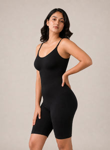 Model in the black shapewear bodysuit, hand on hip